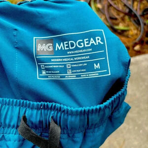 Turquoise MedGear pants for woman, size medium.